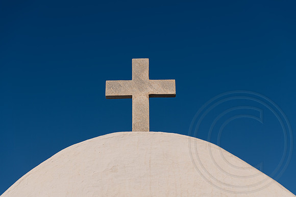 Stone Cross on blue sky