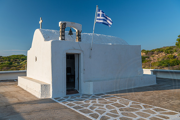 Greek flag over Church on Milos